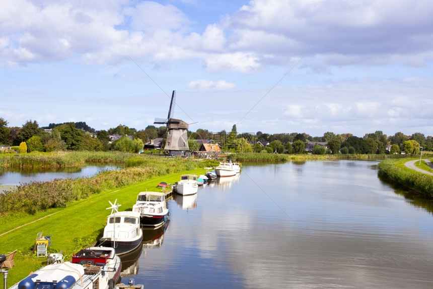 荷兰风力加小船在河边的荷兰风力厂环境的过去乡村图片