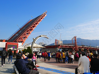 港口文化釜山南朝鲜2017年五月三日延多台桥是韩国第一个也唯座吊桥它已成为著名的釜山里程碑钓鱼背景图片