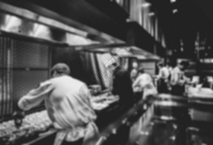 一顿饭餐厅厨房的师运动使食物变黑白品专业知识商的图片