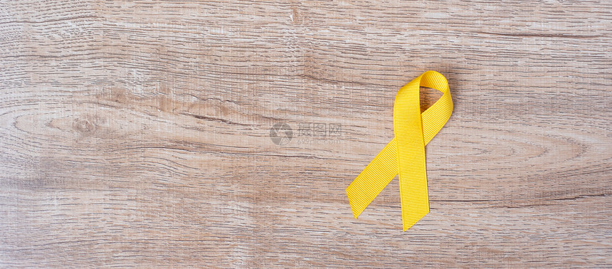 黄色丝带预防儿童癌症概念图片