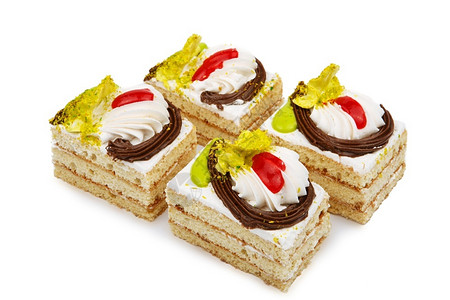 富有的白饼干蛋糕装饰在色背景上隔绝的鲜奶油花庆祝典背景图片