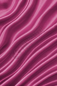 平滑优雅的粉色丝绸或纹质可用作背景投标光滑的缎图片