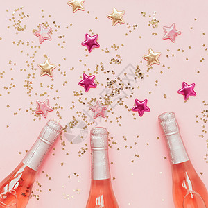 闪亮彩色星星与粉色香槟图片