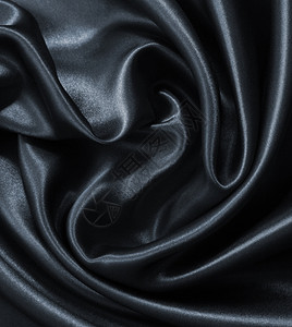 海浪黑色的平滑优雅深灰色丝绸或可用作背景时尚图片