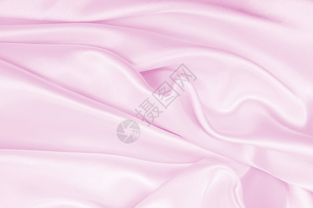 闪亮的平滑优雅粉色丝绸或派文纹理可用作婚礼背景材料自然丝滑图片