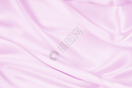 柔软的平滑优雅粉色丝绸或派文纹理可用作婚礼背景材料闪亮的缎面图片