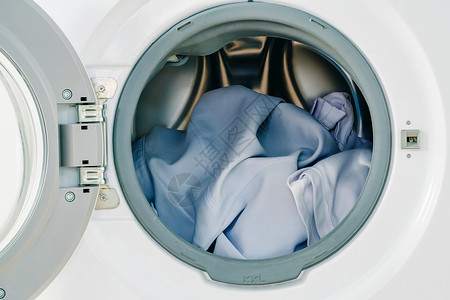 电气洗钱衣机背景涤的白色衣服脱家庭高清图片