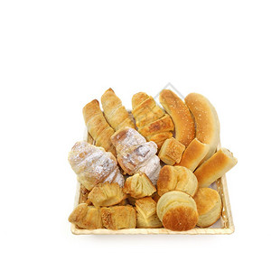 早晨片状白底面包或篮中烘烤糕饼制品的种类繁杂糕点图片