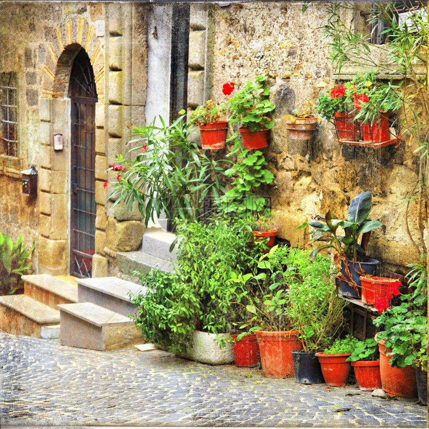 花的艺术品建造迷人的意大利中世纪古老村庄拥有典型的花卉狭窄街道斯佩洛翁布里亚图片