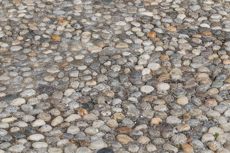 途径花岗岩石为行人铺路面的石块背景图案地上的石块布料图片