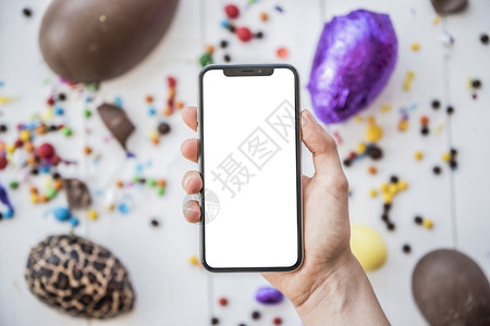 花朵解析度季节高清晰相片人持智能手机的携带空白屏幕Eastereconds彩蛋的优质照片用空白屏幕Eastereggs背景图片