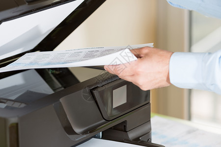纸影外围设备办公室按钮使用多功能打印机进行影员工作背景