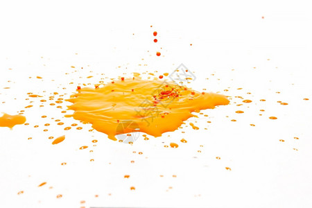 一种花橙色水滴喷洒在白背景上飞沫图片