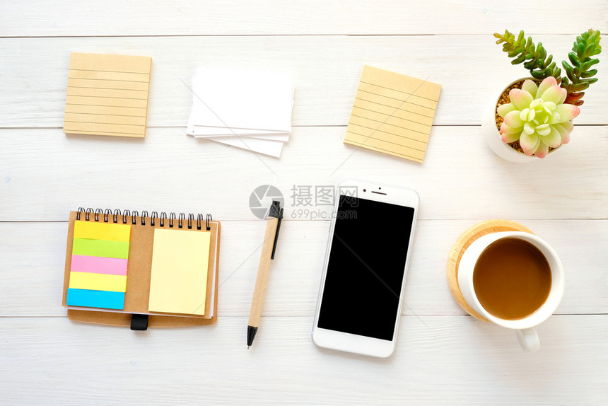 白木桌背景上的空白纸名片智能电话笔和咖啡并有文字顶视图的复制空间床单为了笔记本图片
