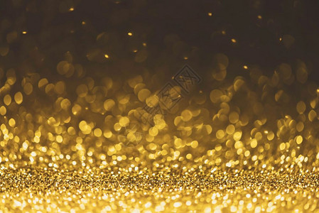 双闪灯金色闪光灯背景散焦抽象烁和亮的星圣诞和新年派对概念背景特写星尘喜庆的金光闪微设计图片
