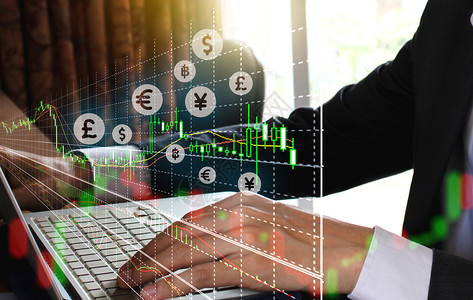 交换金融的技术使用笔记本电脑和股票市场或适合金融投资概念的前方图表双接触重交易商背景图片