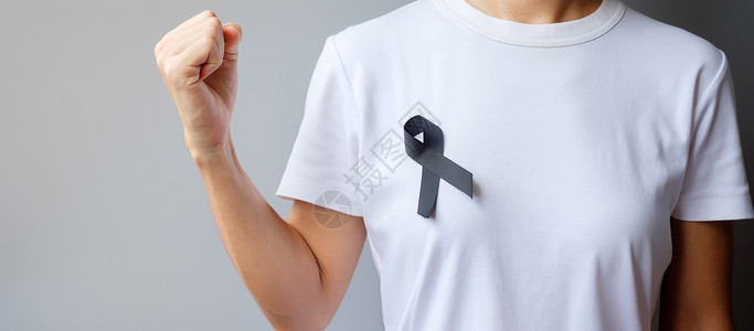 佩戴黑丝带预防癌症概念图片