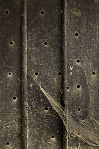 黑色的肮脏和废弃卷状金属背景纹身细节泥土和废墟优质的生锈图片