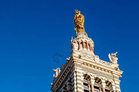 蔚蓝之巅法国马赛Gardde圣母玛丹娜将小放在法国马赛的NotreDamedelaGarde之顶上的金雕像婴儿加德历史背景