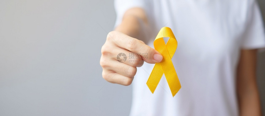 天预防日Sarcoma骨膀胱和儿童癌症意识月支持生活和患病儿童保健世界癌症日概念的黄丝带健康护理和世界癌症日概念男人希望图片