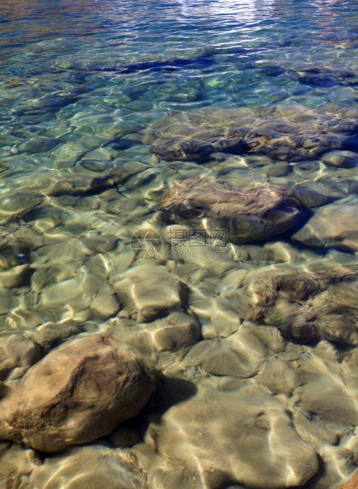 泻湖旅行绿松石希腊林多斯的绿化水域图片