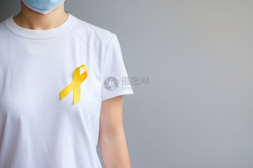 斗争预防日Sarcoma骨膀胱和儿童癌症意识月支持生活和患病儿童保健世界癌症日概念的黄丝带健康护理和世界癌症日概念关心病人图片