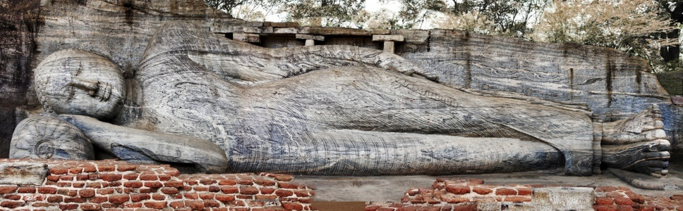 波隆纳鲁沃著名的佛教斯里兰卡旅行和地标古老城市Polonnaruwa教科文组织世界遗产迹在斯里兰卡古城Polonnaruwa岩石雕刻的佛像背景