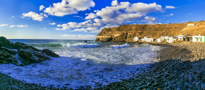 普埃尔蒂托海岸线富埃特文图拉传统渔业村PuertitodelosMolinosCanary群岛的美丽自然和海洋Fuerteventura岛背景