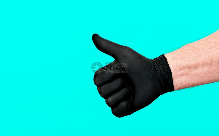 专业的援助救男手戴套拇指举起大显示好牌防止细菌和个人安全和卫生的概念图片