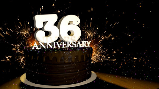 木周年乐趣颜色周年纪念36卡圆形巧克力蛋糕装饰着蓝色红黄绿的糖衣杏仁木桌上有白色数字背景是人造火星和彩色糖衣落在桌子上3D插图周年纪念设计图片