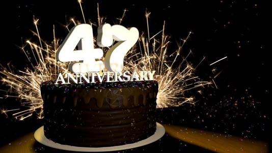 基多人造的魔法周年纪念47卡圆形巧克力蛋糕装饰着蓝色红黄绿的糖衣杏仁木桌上有白色数字背景是人造火星和彩色糖衣丸落在桌子上3D插图设计图片