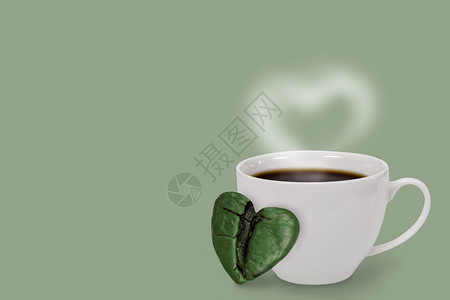 一杯咖啡豆和绿色心菜配有复制空间情人节和爱的概念咖啡店丰富多彩的饮料图片