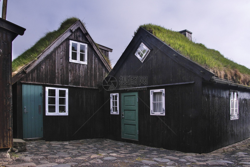 鹅卵石迷人的建造图象式住宅区在法罗群岛Streymoy岛STreymoyposcardMotif上的Tinganes老城镇托尔沙图片