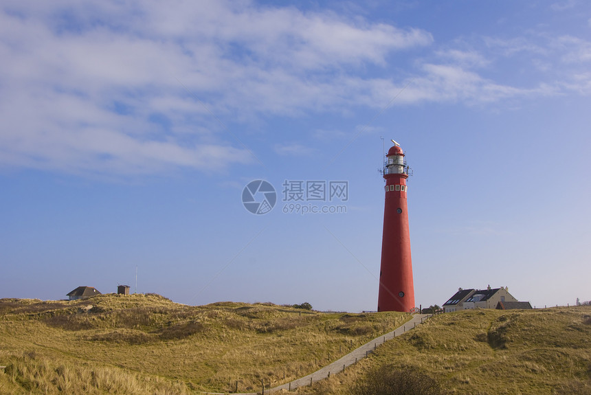 施耶门尼库格的Dunes红灯塔天空蓝色灯塔沙丘绿色图片