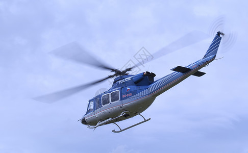 贝尔412飞行警察救援航班蓝色菜刀直升机航展背景图片
