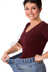 瘦了很多体重幸福牛仔裤黑发女性化减肥饮食女性背景图片