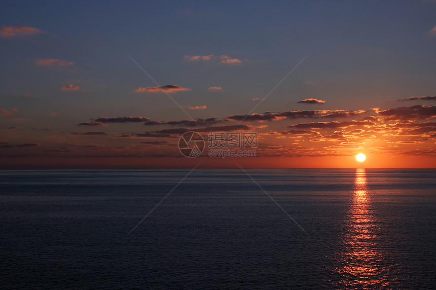 太阳日落假期地平线橙子海岸线热带旅行阳光反射风景天空图片