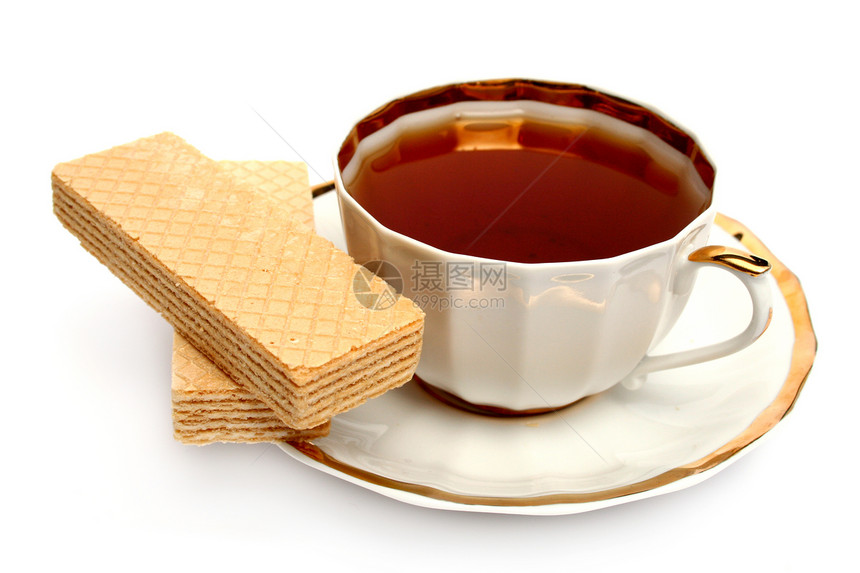 两杯面包和一杯茶陶瓷餐厅饼干茶杯香气甜点咖啡店早餐盘子食物图片