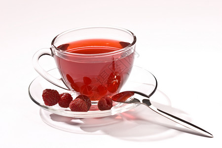 果茶玻璃鲁棒性食物飞碟水果玻璃状柠檬覆盆子早餐红色背景