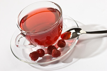 果茶水果早餐玻璃盘子飞碟鲁棒性红色勺子柠檬玻璃状背景