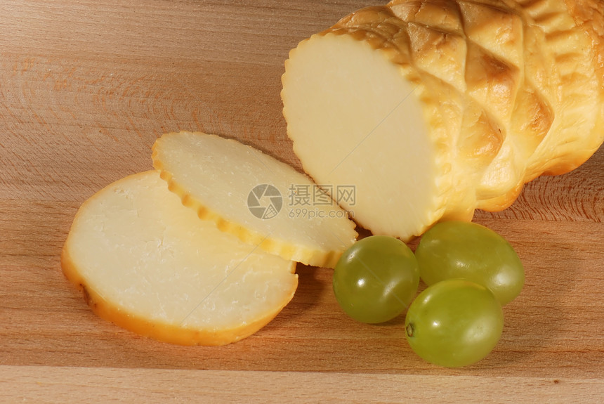 木板上的奶酪抛光派对地区性日记食物水果木头茶点圆形奢华图片