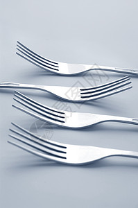 叉餐厅晚餐服务用具厨房金属宏观曲线背景图片