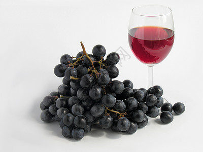 红酒和葡萄水果红色背景图片