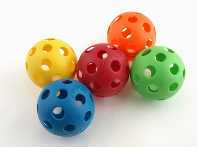 色彩多彩的塑料玩具球蓝色红色空气游戏黄色橙子绿色背景图片