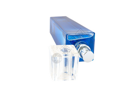 深蓝色的香水瓶子里的香水烧瓶玻璃白色香水厂金属灰色香味背景图片