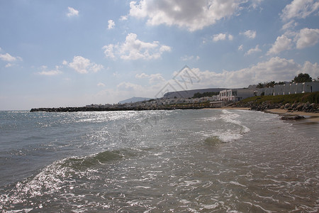 海滩视图太阳热带航海波浪闲暇国家蓝色山脉岩石天空高清图片