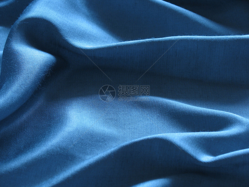 蓝丝绸背景摘要蓝色曲线柔软度纺织品材料折叠图片