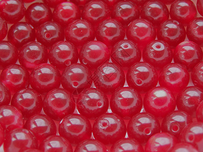 红珠宏观微光圆形珠子背景图片