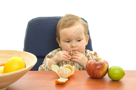 吃水果的宝宝宝宝吃水果橙子柠檬女孩免疫孩子食物背景