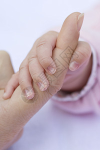 爱婴手粉色手指婴儿孩子指甲背景图片